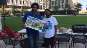 Roger Riddle (left), with the Akron/Summit Convention & Visitors Bureau, was awarded a fellowship this summer from a partnership between the Knight Foundation and Niantic, makers of Pokemon Go. At Saturday's event, he was joined by musician Floco Torres.