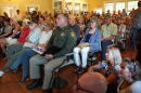 Community members pack the Old Wilson Schoolhouse Community Center on Aug. 7, 2026.