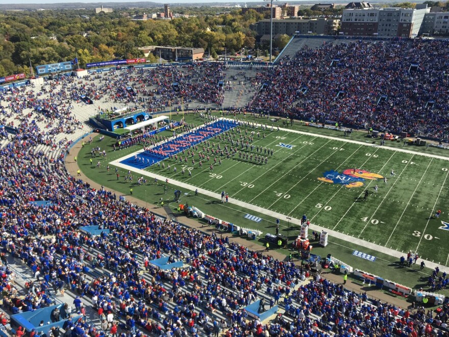 KU Marching Band takes the field in front of a sold-out stadium in Lawrence on Saturday, October 8, 2022. (Photo by Greg Echlin)
