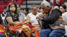 Ray Doyah, the first to speak on his experiences at an Indian boarding school, bows his head as he listens to others speak at a meeting to hear about the painful experiences of Native Americans who were sent to government-backed boarding schools designed to strip them of their cultural identities, Saturday, July 9, 2022, in Anadarko, Okla. One by one, Native American tribal elders who were once students at government-backed Indian boarding schools testified about the hardships they endured: beatings, whippings, sexual assaults, forced haircuts and painful nicknames. (AP Photo/Sue Ogrocki)