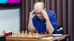 GM Joel Benjamin concentrates on his move during round 8 of the U.S. Senior Championships in 2019.