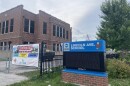A banner hung outside Lincoln Avenue Elementary reads in Spanish, "Let's have a safe summer. Let children play in clean neighborhoods free of violence." The school was destroyed by a fire on the night of June 29, 2026.