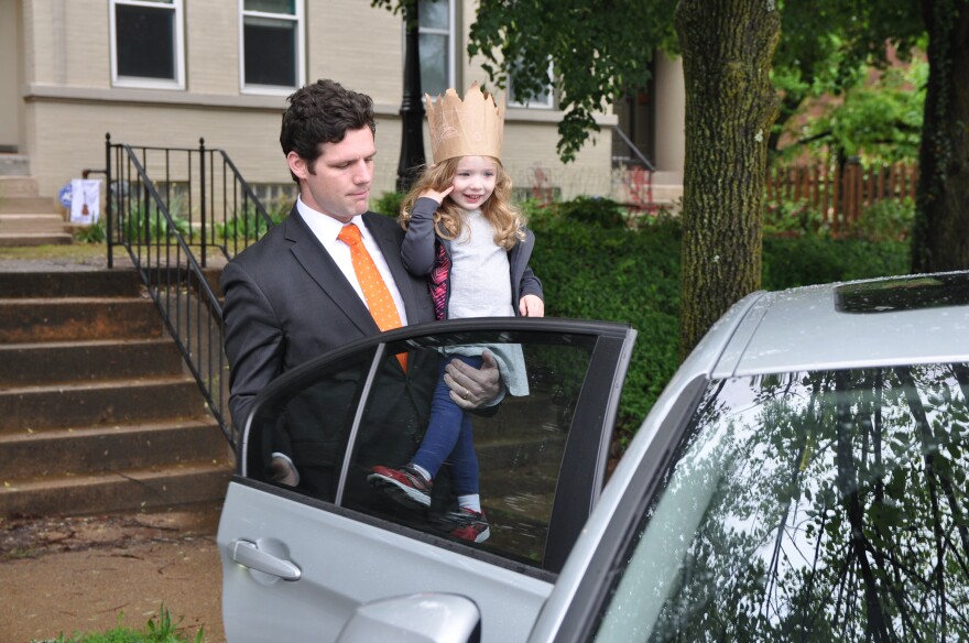 David Mueller, 31, picks up his three-year-old daughter Marjorie from daycare on May 4, 2017. She has a rare form of cystic fibrosis, and Mueller worries the Republican health plan will affect the family's ability to pay for her care.