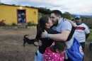 Carlos Uzcategui, one of the Venezuelan migrants deported months ago to El Salvador by the United States under an immigration crackdown, is welcomed home by his wife, Gabriela Mora, in Lobatera, Venezuela, Wednesday, July 23, 2025. (AP Photo/Ariana Cubillos)