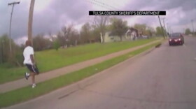 A screen shot of a video showing Eric Harris running from Tulsa County Sheriff's deputies after he allegedly tried to sell a weapon to an undercover officer