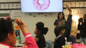 Lenoir County Early College high schoolers teach third graders at Northwest Elementary in Kinston the basics of borrowing and lending.