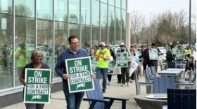 Faculty walk the picket line Friday morning near the UIS Student Union.