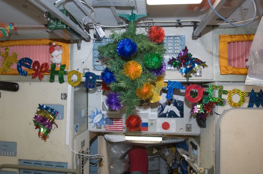 Ornaments adorn the Russian segment of the International Space Station in preparation for Christmas. This scene is in the Zvezda module, but not too far away, on the NASA side of the outpost, stockings and other decorations were soon being prepared for the holiday.