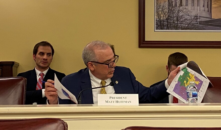  Senate President Matt Huffman (R-Lima) looks at printouts of maps offered during the second meeting of the Ohio Redistricting Commission, as he questions Chris Glassburn, the map drawer for the Commission's two Democrats.