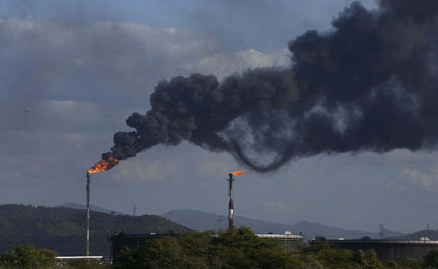 FILE - Gas is flared at the Jose Antonio Anzoategui oil complex in Barcelona, Anzoategui State, Venezuela, Tuesday, Jan. 9, 2024. (AP Photo/Matias Delacroix, File)