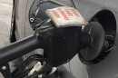 A pump fills the gas tank on a vehicle at a Peoria gas station. 