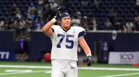 FILE - Dallas Cowboys offensive tackle Shiyazh Pete waves to fans after an NFL football practice on Aug. 26, 2026, in Frisco, Texas. (AP Photo/Tony Gutierrez, File)