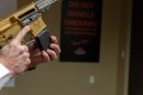 Nephi Cole, director of government relations state affairs for the National Sports Shooting Foundation, loads and unloads a 10-round magazine from an AR-15 semiatuomatic rifle at Bristlecone Shooting, Training and Retail Center in Lakewood, Colorado, on Thursday, Jan. 16, 2025. The Colorado legislature is considering a bill that would ban the manufacture, purchase and sale of semiautomatic rifles and shotguns that are capable of accepting detachable ammunition magazines, as well as some semiautomatic pistols and handguns. (Jesse Paul, The Colorado Sun)