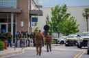 Law enforcement personnel respond to reports of a shooting at Mall of Louisiana in Baton Rouge, La., Thursday, April 23, 2026.