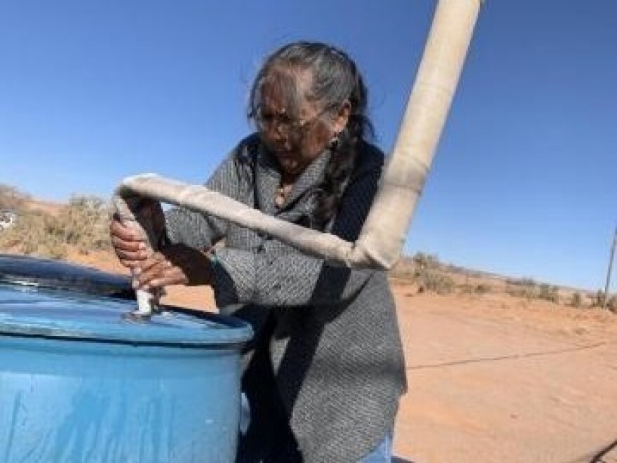 Darlene Yazzie, a retired community health worker, says hauling water, firewood, and trash, and using an outhouse are just a few of the things that make life hard on the Navajo Nation.