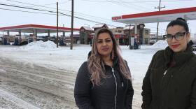 Martha Hernandez (left) and Ana Suda standing outside a gas station in Havre.