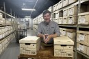 Dayton History President and CEO, Brady Kress and some of the thousands of NCR related documents now being stored at the Mark and Paula Hurd NCR Archive Center.