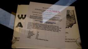 A WorkOne employment office with a closed sign on the door.