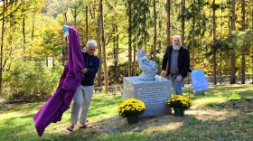 Louise McDonnell, founder of the Friends of Shady Lane Cemetery, unveils the Clover section monument with board member Bill Lester.