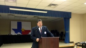 Former Commerce ISD Superintendent Blake Cooper addresses attendees at the CISD administration building.