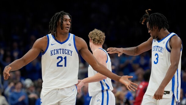 Kentucky forward Jayden Quaintance (21) celebrates his dunk against St. John's during the second half of an NCAA basketball game, Saturday, Dec. 20, 2025, in Atlanta. (AP Photo/Mike Stewart)