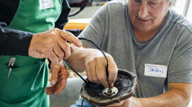  Mark Bowen, left, and Joe Prin work on a busted lamp at Boise's first Repair Café.
