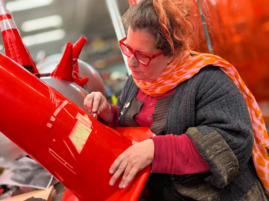 Sarah Davitt, Milwaukee's first Public Artist in Residence, carves Milwaukee landmarks into traffic cones. The cones will be used to decorate the "Art Car," which will be seen around the city this summer to spark discussions about safe driving.