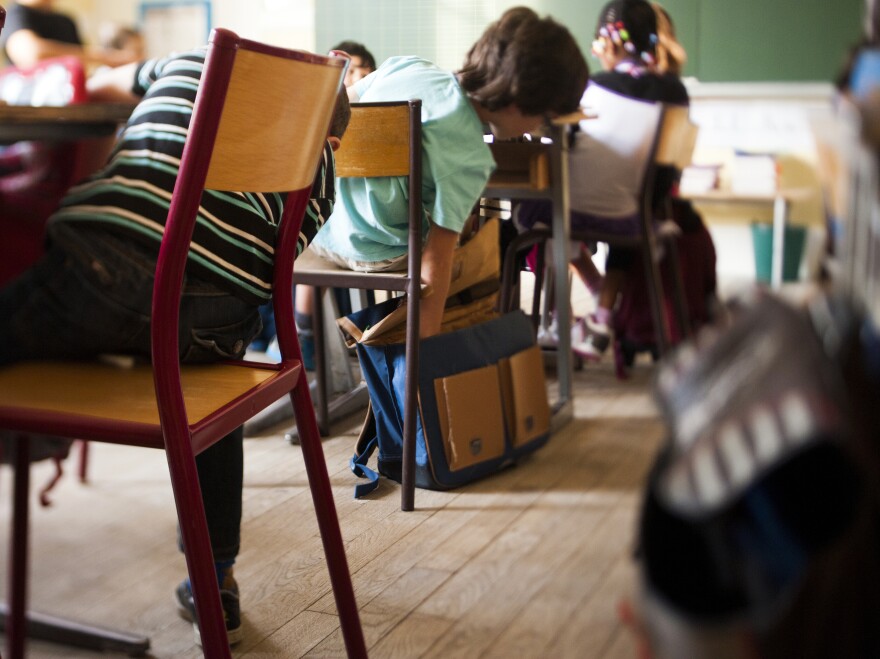 President Francois Hollande argues that homework puts poor children at a disadvantage, but others argue the extra work is needed to help those students succeed.