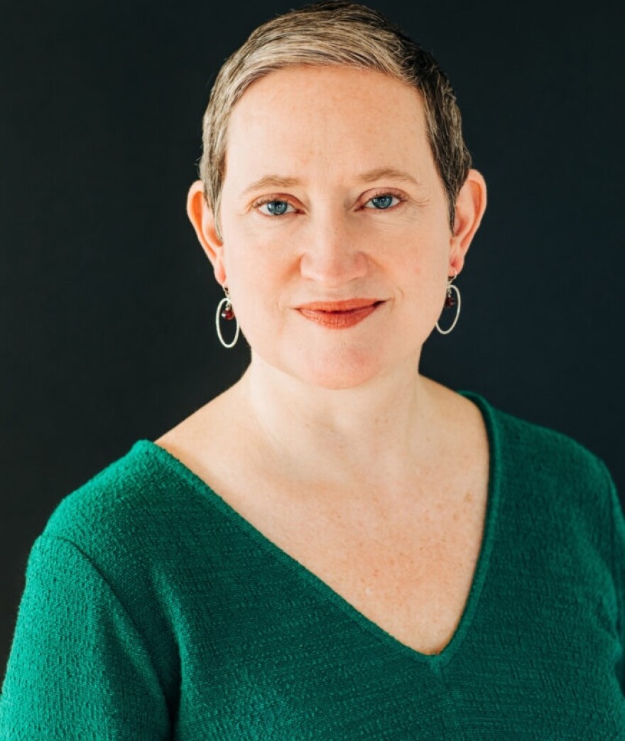 Portrait of composer and pianist Rachel Grimes wearing a green v neck sweater