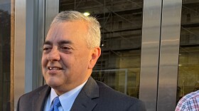 A close up of a man in a suit