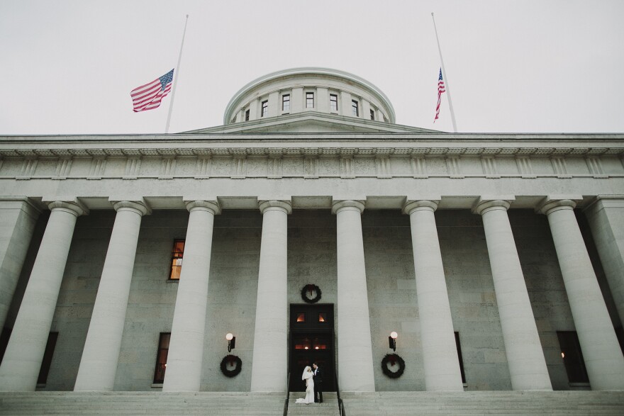 Holly and Spencer Gross in front of the Ohio Statehouse on their wedding day.