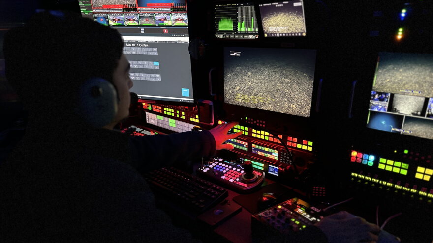 Adam Harper in front of screens 1