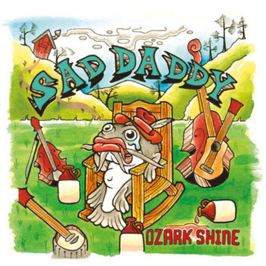 A cartoon drawing of a fish sitting in a chair with a bass and guitar to its right, a violin to its let and a banjo at  its feet.