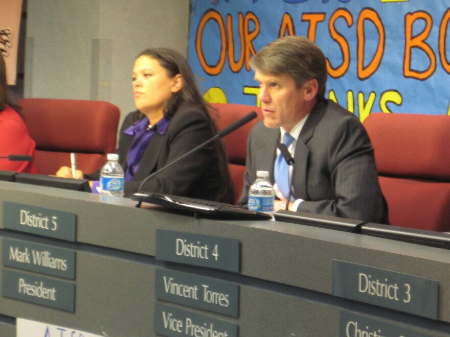 AISD Superintendent Meria Carstarphen and school board president Mark Williams listen to angry parents during public comment period of last night's board meeting.