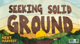 An illustration of a sun rising over the horizon of a farm. Large brown letters in the sky spell "Seeking Solid Ground." "The Next Harvest" is written in yellow text on the lefthand corner. The KBIA logo is in white in the right corner. 