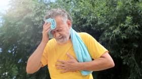 File photo: Senior man suffering from heat stroke outdoors.
