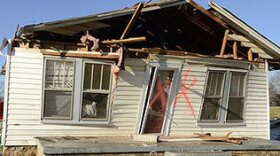 Friends and family help remove the contents from Kenneth Shull and Tina Woodruff's home on Johnson Bridge Road in Hildebran