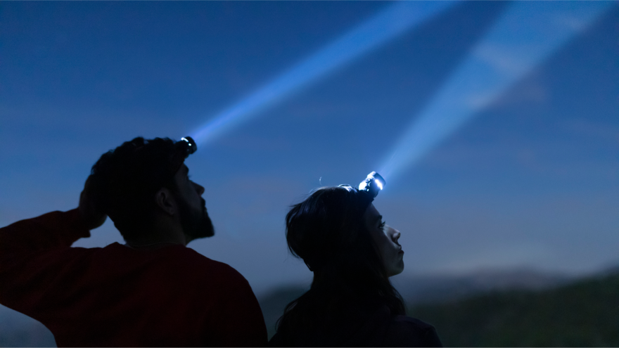 Individuals taking a night hike