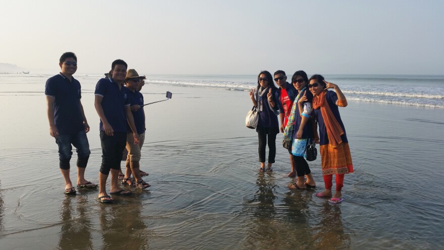 Tourists gather on the beach in Cox's Bazar, Bangladesh's current beach destination.
