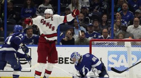 Carolina Hurricanes center Jordan Staal (11) celebrates after right wing Sebastian Aho scored past Tampa Bay Lightning goaltender Andrei Vasilevskiy (88) during overtime in Game 3 of an NHL hockey Stanley Cup second-round playoff series Thursday, June 3, 2021, in Tampa, Fla. (AP Photo/Chris O'Meara)