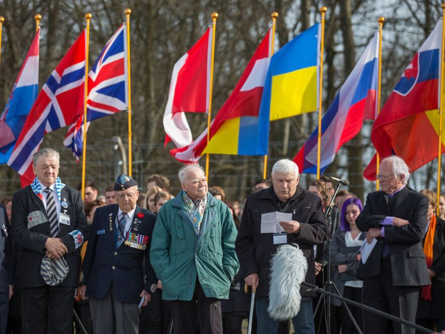 Boris Romantschenko reads from a piece of paper into a microphone at the Buchenwald memorial on April 12, 2015. He was killed by Russian shelling in Kharkiv.