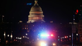 A police car drives away from the U.S. Capitol on Jan. 6, 2021.