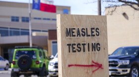 FILE - A sign is displayed outside the Seminole Hospital District offering measles testing, Feb. 21, 2025, in Seminole, Texas.