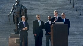 University of South Carolina Darla Moore School of Business research economist Joseph Von Nessen speaks outside the Statehouse in Columbia with Goodwill organizations.