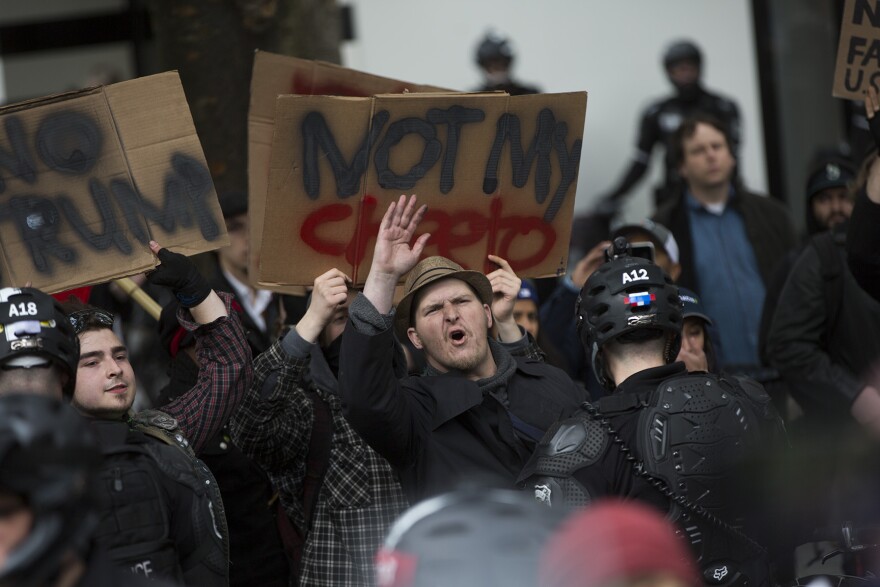 Supporters and protestors clash during a pro-Trump rally at Westlake Plaza in downtown Seattle on Monday, May 1, 2017.