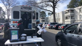 WCPSS bus drivers and nutritionists help distribute meals at Cedar Point Apartments in Raleigh.