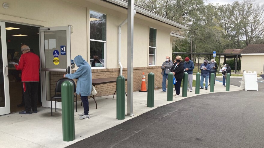 A line forms outside the Mandarin Senior Center after Jacksonville announces it will be used as a COVID-19 vaccination site.