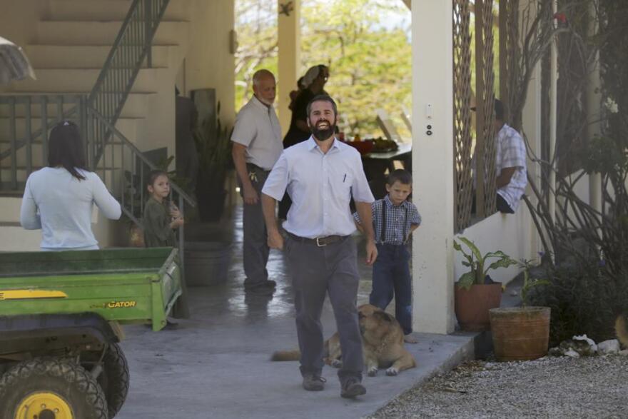 Unidentified people gather at the Christian Aid Ministries headquarters in Titanyen, north of Port-au-Prince, Haiti, Thursday, Dec. 16, 2021. 