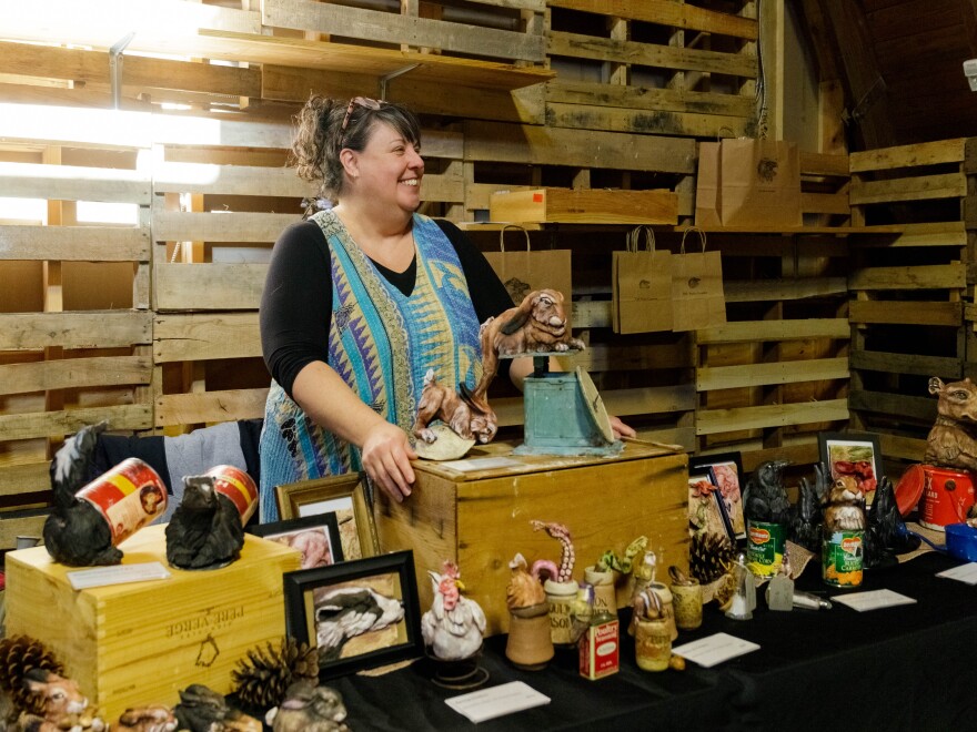 Deana Bada Maloney at her booth showcasing her ceramic animals at the Shuckin’ Awesome Holiday Art Market at Funk Farms Premium Beef in Shirley, Il.