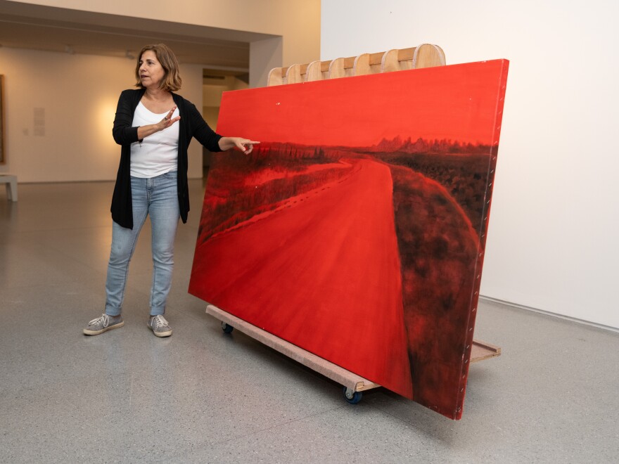 Rescued from her studio in Kibbutz Be'eri near Israel's border with Gaza, artist Ziva Jelin's damaged painting Curving Road is currently on special display in the Israeli Art gallery of the Israel Museum in Jerusalem.